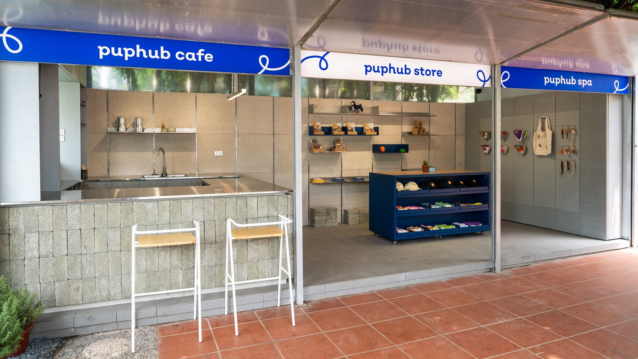 PupHub Cafe, Store, and Spa storefronts with branded signage
